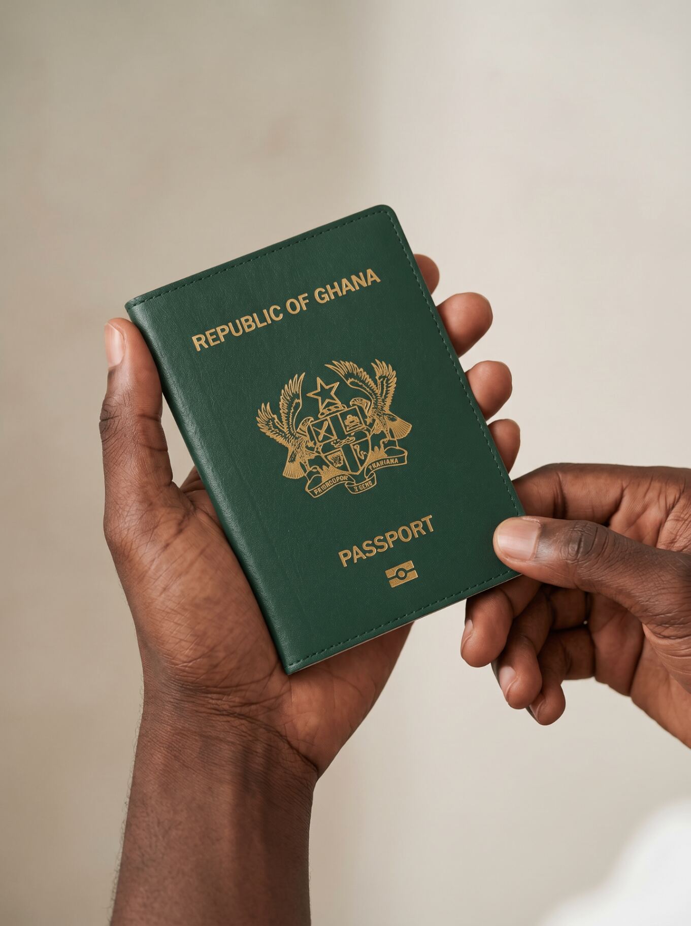 Hands holding a Republic of Ghana passport